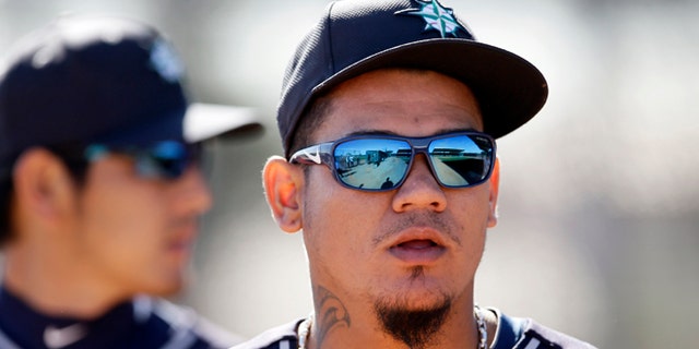 Seattle Mariners' Felix Hernandez walks out of the bullpen after a throwing session during spring training baseball practice, Thursday Feb. 20, 2014, in Peoria, Ariz. (AP Photo/Tony Gutierrez)