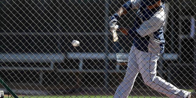 Seattle Mariners' Robinson Cano takes a swing as he participates in batting drills during baseball spring training, Wednesday, Feb. 26, 2014, in Peoria, Ariz. (AP Photo/Tony Gutierrez)
