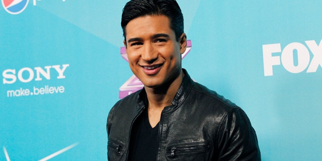 Host Mario Lopez poses at the party for the finalists of television series "The X Factor" in Los Angeles, California November 5, 2012