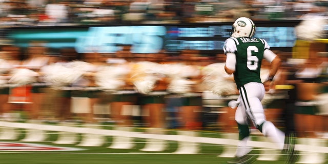 EAST RUTHERFORD, NJ - NOVEMBER 27:   Mark Sanchez #6 of the New York Jets runs onto the field before the game against the Buffalo Bills during their pre season game on November 27, 2011 at  MetLife Stadium in East Rutherford, New Jersey.  (Photo by Al Bello/Getty Images)