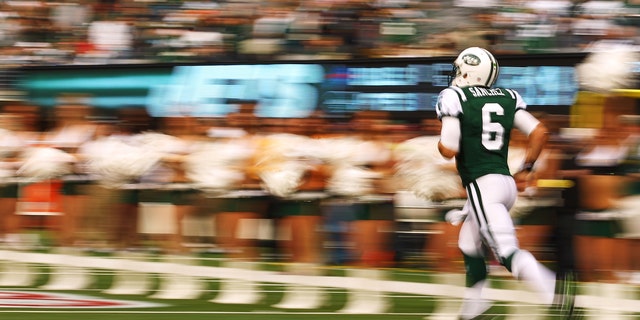 EAST RUTHERFORD, NJ - NOVEMBER 27: Mark Sanchez #6 of the New York Jets runs onto the field before the game against the Buffalo Bills during their pre season game on November 27, 2011 at MetLife Stadium in East Rutherford, New Jersey. (Photo by Al Bello/Getty Images)