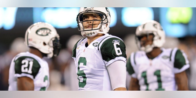 New York Jets quarterback Mark Sanchez (6) looks on with teammates LaDainian Tomlinson (21) and Jeremy Kerley (11) during the fourth quarter of an NFL football game, Sunday, Nov. 13, 2011, in East Rutherford, N.J. The Jets lost the game 37-16. (AP Photo/Bill Kostroun)