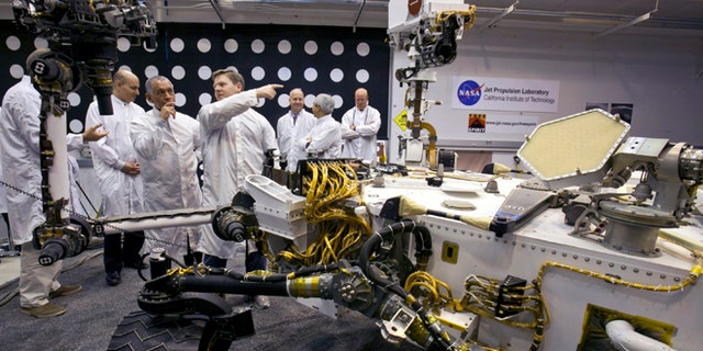 Feb. 22, 2011: NASA administrator Charles Bolden, third from left, listens to engineer Matt Robinson, during a tour of a replica of the Mars Science Laboratory rover at NASA's Jet Propulsion Laboratory in Pasadena, Calif.