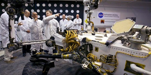 Feb. 22, 2011: NASA administrator Charles Bolden, third from left, listens to engineer Matt Robinson, during a tour of a replica of the Mars Science Laboratory rover at NASA's Jet Propulsion Laboratory in Pasadena, Calif.