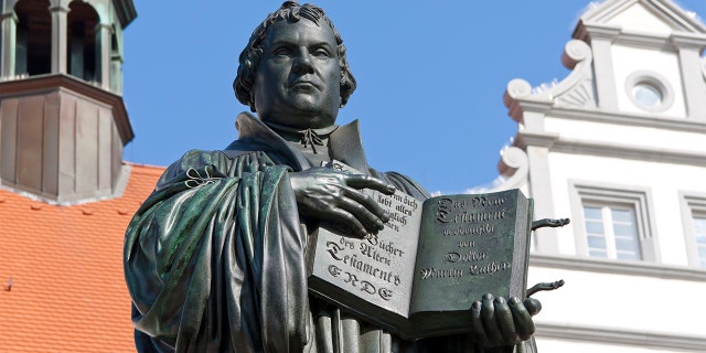 Monument of Martin Luther in Wittenberg, Germany. It was the first public monument of the great reformer, designed 1821 by Johann Gottfried Schadow. Martin Luther (1483-1546) was a German monk, theologian, and church reformer and the translator of the bible into German. He is also considered to be the founder of Protestantism. He lived and worked many years in Wittenberg.