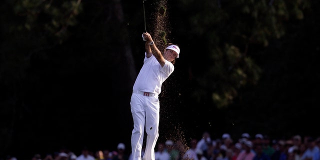 Bubba Watson hits off the 18th fairway during the fourth round of the Masters golf tournament Sunday, April 8, 2012, in Augusta, Ga. (AP Photo/David J. Phillip)