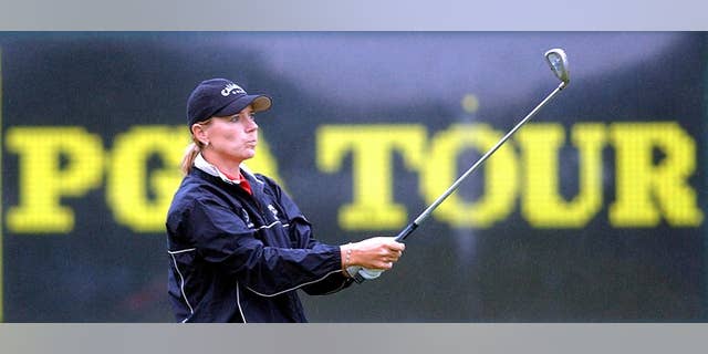 FILE - This is a May 20, 2003, file photo showing golfer Annika Sorenstam hitting in the rain at the driving range of the Colonial Country Club in Fort Worth, Tx. Annika Sorenstam ranks among the best female golfers of all-time. She's still the richest, with career earnings of more than $22 million, despite retiring in 2008. But what fans remember most about the Swedish superstar might be the time she mixed it up with the boys on the PGA Tour at the Colonial in 2003. (AP Photo/Dave Martin, File)