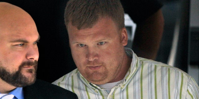 June 20, 2012: Matt Sandusky, right, adopted son of former Penn State assistant coach Jerry Sandusky, leaves the Centre County Courthouse in Bellefonte, Pa.