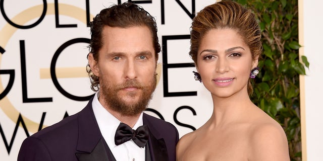 Matthew McConaughey and wife Camila Alves at the Golden Globe Awards on January 11, 2015 in Beverly Hills, California.