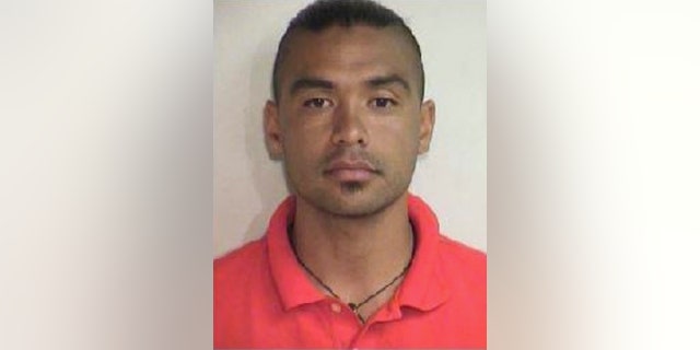 This Aug. 20, 2015 booking photo released by the Maui County Police Department shows Joshua Mangauil, who was one of several people arrested early Thursday, Aug. 20, 2015, during a protest against a Maui solar telescope, in the effort to stop a giant telescope on the Big Island. Protesters gathered Wednesday night to attempt to stop a convoy delivering materials to Haleakala, where the Daniel K. Inouye Solar Telescope is being built. (Maui County Police Department via AP)