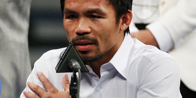 MAY 2: Manny Pacquiao answers questions during a press conference following his welterweight title fight against Floyd Mayweather Jr. in Las Vegas.