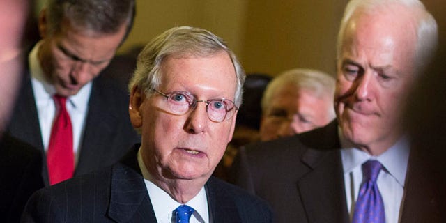 FILE: Nov. 13, 2014: Senate Minority Leader Mitch McConnell, R-K.Y., with GOP Sens. John Thune, S.D., and John Cornyn, Texas, on Capitol Hill, in Washington, D.C.