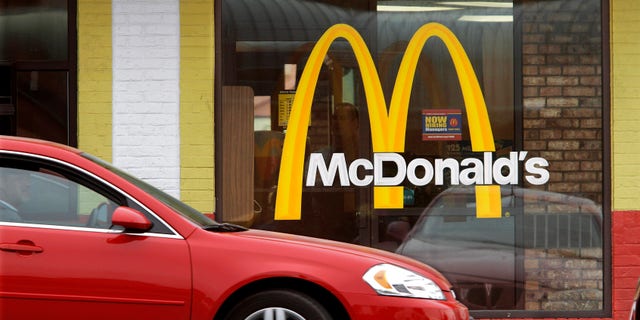 In this Oct. 17, 2011 file photo, a car moves through a McDonald's drive through window line, in Springfield, Ill.