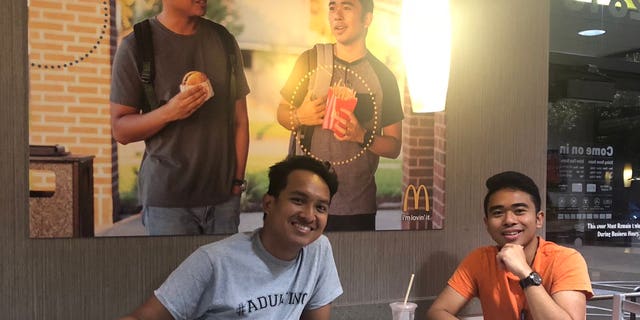The two men placed the picture to promote diversity at the fast-food chain.