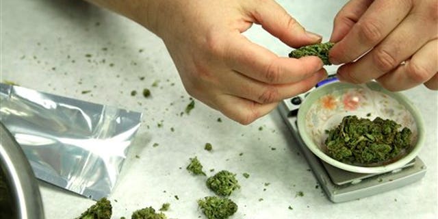 Marijuana is weighed and packaged for sale at the Northwest Patient Resource Center medical marijuana dispensary in Seattle.