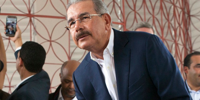 Danilo Medina casts his ballot during the general elections in Santo Domingo, Sunday, May 15, 2016.