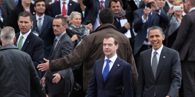 President Obama, right, and Russian President Dmitry Medvedev walk together as they arrive at the G8 Summit, in Deauville, France, Thursday, May 26, 2011. (AP)