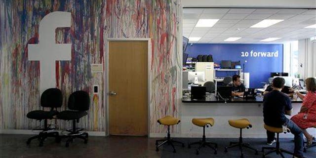This May 11, 2012, photo shows workers at the Facebook office in Menlo Park, Calif.