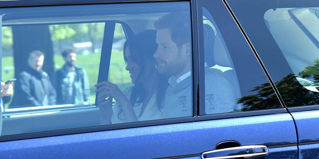 Meghan Markle wore $10,000 earrings and white blouse upon arrival in Windsor for the royal wedding rehearsal.