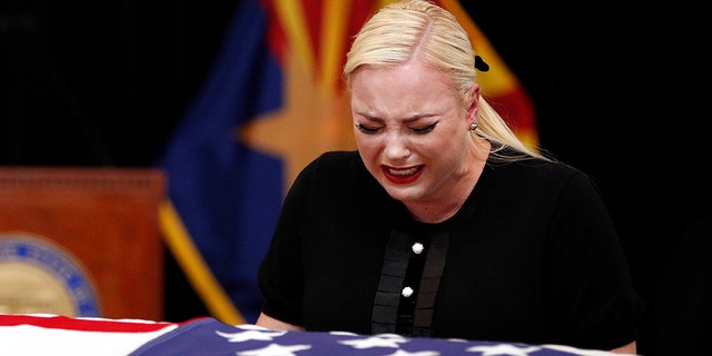 Meghan McCain, daughter of Sen. John McCain, R-Ariz., cries at the casket of her father during a memorial service at the Arizona Capitol on Wednesday in Phoenix.
