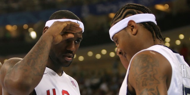 BEIJING - AUGUST 20:  Lebron James #6 and Carmelo Anthony #15 of the United States salute one another before the men's basketball quarterfinal game against Australia at the Olympic Basketball Gymnasium during Day 12 of the Beijing 2008 Olympic Games on August 20, 2008 in Beijing, China.  (Photo by Streeter Lecka/Getty Images)