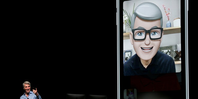 Apple senior vice president of Software Engineering Craig Federighi speaks with Apple CEO Tim Cook using the new group Facetime feature at the Apple Worldwide Developer conference (WWDC) in San Jose, California, U.S., June 4, 2018. REUTERS/Elijah Nouvelage - RC1A8138D8E0