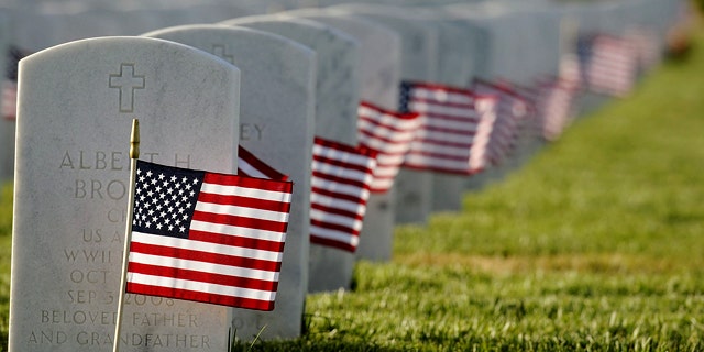 Members of several service organizations including Boy Scouts, Girl Scouts, 4-H and private citizens fanned out across the 561-acre Sacramento Valley National Cemetery in Dixon, Calif. to make sure every one of the grave nearly six thousand armed service members buried received a flag the on Thursday, May 27, 2010 in preparation for Monday's Memorial Day Service at the VA Cemetery.(AP Photo/The Reporter, Joel Rosenbaum) MANDATORY CREDIT; MAGS OUT; NO SALES