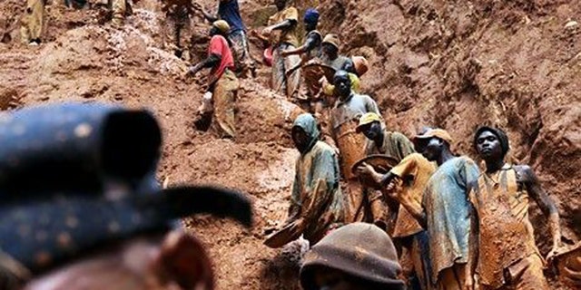 Men work in a gold mine in Chudja, northeastern Congo, one of the areas in which so-called "conflict minerals" are mined.