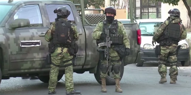 Mexican police outside the house where Ruben Oseguera Gonzalez - a.k.a., "El Menchito" - was arrested. (Source: Via YouTube)