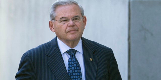 U.S. Sen. Bob Menendez arrives at Newark federal court, Thursday, April 2, 2015, in Newark, N.J. Menendez, the top Democrat on the U.S. Senate Foreign Relations Committee, was indicted Wednesday on corruption charges. A federal grand jury indictment accuses Menendez of using the power of his Senate seat to benefit Salomon Melgen, a wealthy Florida eye doctor who prosecutors say provided the senator with luxury vacations, airline travel, golf trips and tens of thousands of dollars in contributions to a legal defense fund. (AP Photo/John Minchillo)