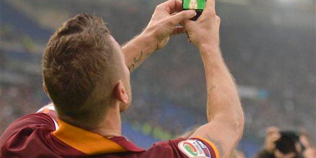 Roma's Francesco Totti takes a selfie after scoring during a Serie A soccer match between Roma and Lazio.