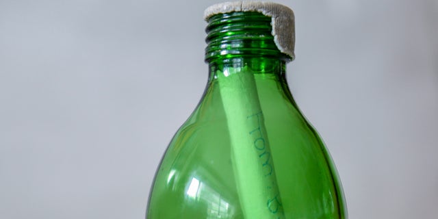 NEW YORK, NY - JULY 12: In this photo illustration, a bottle with a rolled up message, written by Mimi Fery's deceased daughter Sidonie Fery, is seen at Fery's home July 12, 2013 in New York City. Patchogue parks workers found Sidonie's message, "Be excellent to yourself, dude," along with a phone number within a bottle that had washed up with Hurricane Sandy debris and got in touch with Fery to deliver back to her. (Photo illustration by Larry Busacca/Getty Images)