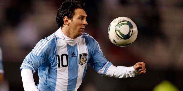 Argentina's Lionel Messi keeps his eye on the ball at a friendly soccer match with Albania ahead of the upcoming 2011 Copa America in Buenos Aires, Argentina, Monday June 20, 2011. (AP Photo/Natacha Pisarenko)