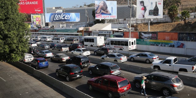 Traffic waits to cross the border into the United States on October 2, 2013 in Tijuana, Mexico.