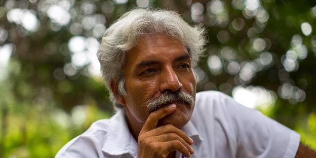 In this Nov. 6, 2013 photo, Doctor Jose Manuel Mireles, leader of his town's self-defense group, pauses during an interview with the Associated Press at his ranch in the town of Tepalcatepec, in the state of Michoacan, Mexico. The documentary “Cartel Land”, produced and directed by New York-based director Matthew Heineman paired the story of Mireles and his “self-defense” forces battling drug cartels with the tale of a vigilante north of the border: war veteran Tim “Nailer” Foley and his Arizona Border Recon. The film opens on July 2, 2015 in Mexico, a day later in New York and and later in other U.S. cities. (AP Photo/Dario Lopez-Mills)