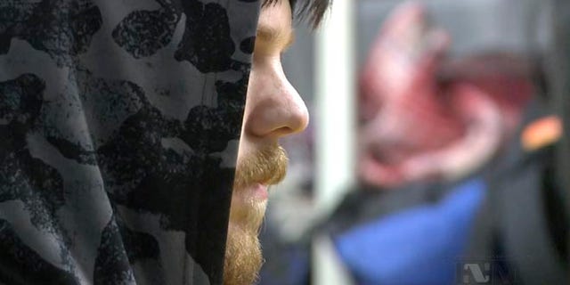 This frame grab from a Thursday, Jan. 28, 2016 taken from a video provided by Mexico's Instituto Nacional de Migracion, INM, shows a hooded Ethan Couch, as he is processed by Mexican immigration agents, in Mexico City. INM said that Couch, who used an "affluenza" defense in a 2013 fatal drunken-driving accident in Texas, was taken to the Mexico City airport from an immigration holding center, ending his month-long stay in Mexico.(Instituto Nacional de Migracion, INM via AP)