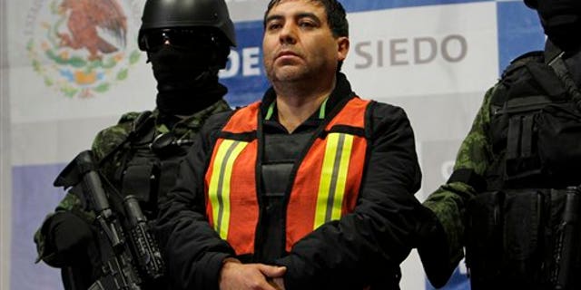 Dec. 26: Felipe Cabrera Sarabia, alias 'El Inge' is shown to the press under the custody of army soldiers at the federal organized crime investigations headquarters in Mexico City.