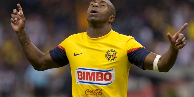 FILE - In this Jan. 19, 2013 file photo, America's Christian Benitez, celebrates his goal against Atlante at a Mexican soccer league match in Mexico City. Benitez, from Ecuador, died Monday, July 29, 2013, a day after playing in a match for Qatari club El Jaish, the team said. The club provided no further details about the death of the 27-year-old Benitez, who moved from Mexican club America to play in Qatar in 2013. (AP Photo/Christian Palma, File)