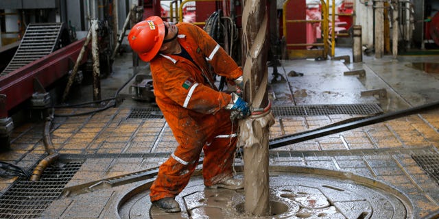 Oil worker on the Centenario deep-water drilling platform off the coast of Veracruz, Mexico, on Nov. 22, 2013.