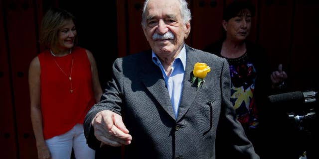 FILE - In this March 6, 2014, file photo, Colombian Nobel Literature laureate Gabriel Garcia Marquez greets fans and reporters outside his home on his birthday in Mexico City. The family of says Nobel laureate Gabriel Garcia Marquez says his health is “very fragile” after he left a Mexico City hospital on April 8. Garcia Marquez is at his home in Mexico City after eight days in the hospital last week for treatment of pneumonia and related problems. (AP Photo/Eduardo Verdugo, File)