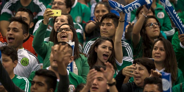 Mexico fans shout anti-gay chants during a World Cup qualifying soccer match against Canada in Mexico City, Tuesday, March 29, 2016. Fans in Mexico are known for yelling a gay slur during kicks by opposing goalkeepers, something that gained global attention during the 2014 World Cup and prompted a FIFA disciplinary probe. (AP Photo/Christian Palma)