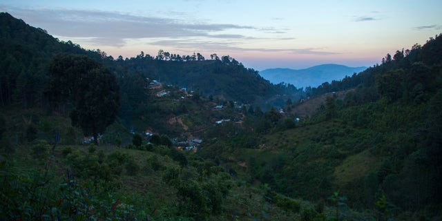 Homes dot the mountainside of the Sierra Madre del Sur where farmers grow poppy in Guerrero state, Mexico.