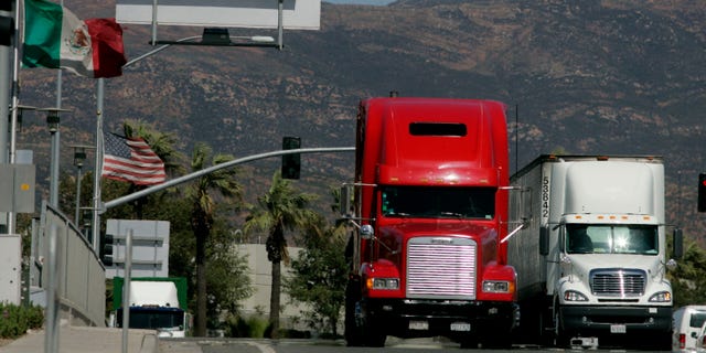 OTAY MESA, CA-MARCH 24: Trucks coming from Mexico prepare to enter the highway after crossing the border March 24, 2009 in Otay Mesa, California. Mexico last week slapped higher tariffs on an estimated $2.4 billion worth of goods entering the country from the U.S. in response to a move by Congress to end a pilot program allowing Mexican trucks to operate in the U.S. (Photo by Sandy Huffaker/Getty Images)