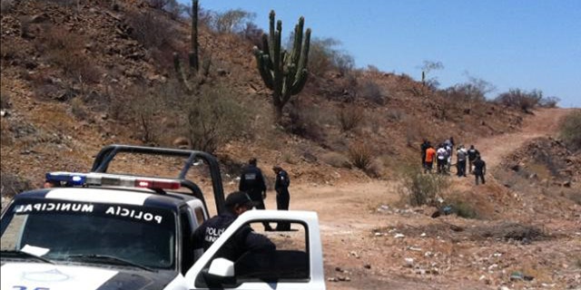 May 18, 2012: Police secure the area where the body of Mexican police reporter Marco Antonio Avila Garcia was found inside a black plastic bag on the side of a road near the city of Empalme, south of Ciudad Obregon, in Sonora state, Mexico.