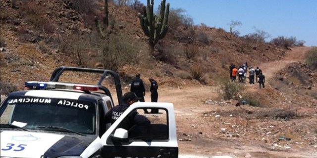 May 18, 2012: Police secure the area where the body of Mexican police reporter Marco Antonio Avila Garcia was found inside a black plastic bag on the side of a road near the city of Empalme, south of Ciudad Obregon, in Sonora state, Mexico.