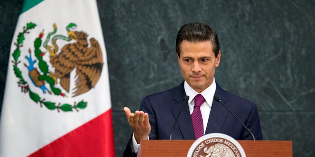 FILE - In this Aug. 27, 2015 file photo, Mexico's President Enrique Pena Nieto speaks during a press conference to announce cabinet changes, at the Los Pinos presidential residence, in Mexico City. Pena Nieto is set to deliver his third state-of-the-nation address on Wednesday, Sept. 2, 2015, amid rising violence, a falling currency and a slowing economy. Pena Nieto shook up his cabinet last week in an apparent attempt to change direction. But tough international market conditions may limit his maneuvering room. (AP Photo/Rebecca Blackwell, File)