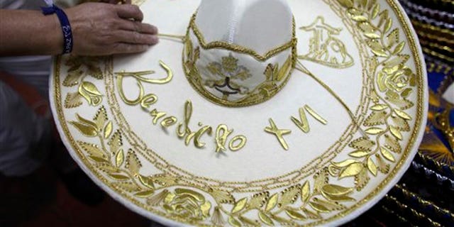 February 29, 2012: Maria de la Luz Yepes shows one of the sombrero's that will be given to Pope Benedict XVI, at her sombrero shop in the town of San Francisco del Rincon, near Leon, Mexico.