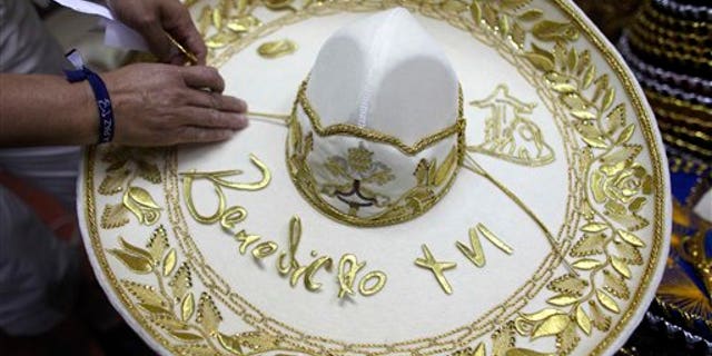 February 29, 2012: Maria de la Luz Yepes shows one of the sombrero's that will be given to Pope Benedict XVI, at her sombrero shop in the town of San Francisco del Rincon, near Leon, Mexico.