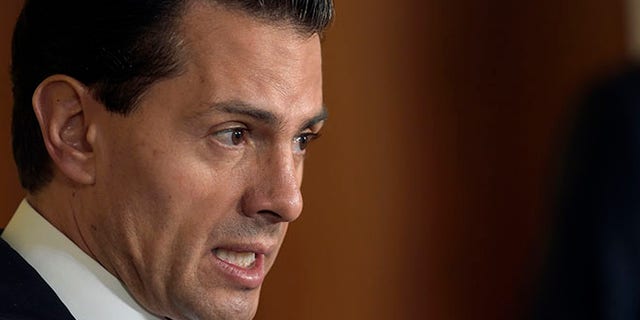 FILE - In this July 22, 2016 file photo, Mexican President Enrique Pena Nieto speaks during a news conference with President Barack Obama in the East Room of the White House in Washington. A new poll published Thursday, Aug. 11, 2016 photo by the newspaper Reforma, suggests approval ratings for the Mexican leader have fallen to 23 percent, while 74 percent disapprove of the job he is doing. The level is the lowest since Pena Nieto took office in December 2012, when he got a 42-percent approval rating in the same poll. (AP Photo/Susan Walsh, File)