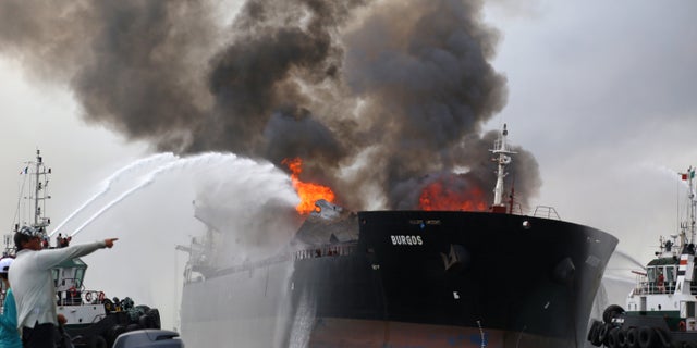 Firefighting boats extinguish a fire aboard the tanker Burgos in Boca del Rio, Mexico, Sept. 24, 2016.